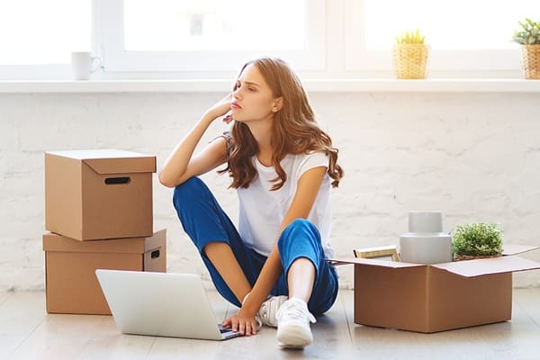 Woman on floor with moving boxes